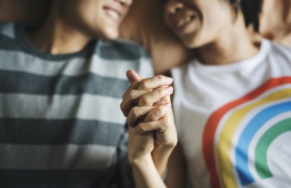 LGBTQ couple holding hands after substance abuse treatment programs