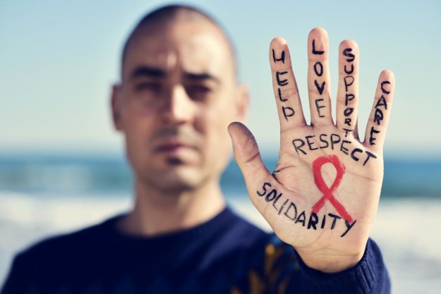 man showing support for hiv and aids